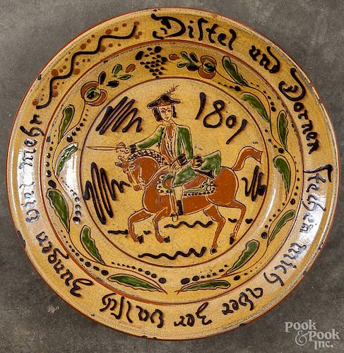 Greg Shooner redware charger with sgraffito decoration of a horse and rider, dated 1999, 13 3/4'' d