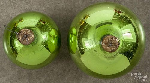 Two green round kugels, approx. 5'' dia. and 3 3/4'' dia.