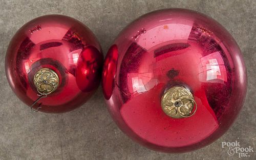 Two ruby red round kugels, approx. 4'' dia. and 5 3/4'' dia.