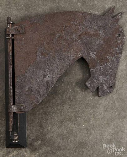 Sheet iron horse trade sign, 19th c., mounted to a contemporary wall bracket, 11'' h.