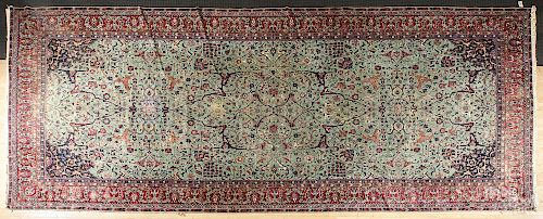 Semi-antique Persian carpet, 23' x 10'6''.