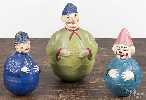 Three composition roly poly toys, early 20th c., one stamped Germany, 6'' h.
