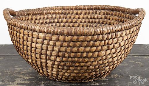 Pennsylvania rye straw basket, 19th c., with open work handles, 8 1/2'' h., 20'' dia.