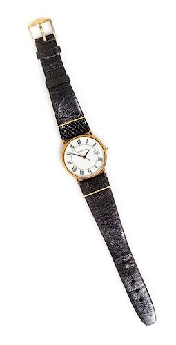 A 14 Karat Yellow Gold Wristwatch, Tiffany & Co., 16.00 dwts.