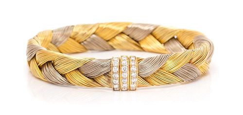 An 18 Karat Tricolor Gold and Diamond Braided Bangle Bracelet, 50.90 dwts.