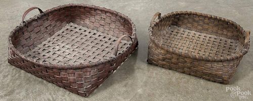 Two large contemporary baskets, 6'' h., 22'' w. and 5 1/4'' h., 18'' w.