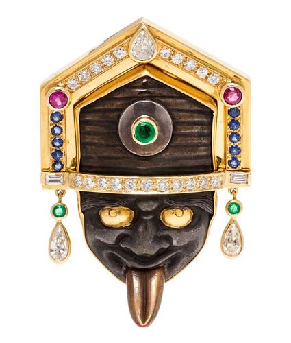 An 18 Karat Yellow Gold, Silver, Diamond, Emerald, Ruby and Sapphire Shakudo Warrior Mask Brooch, 15.40 dwts.