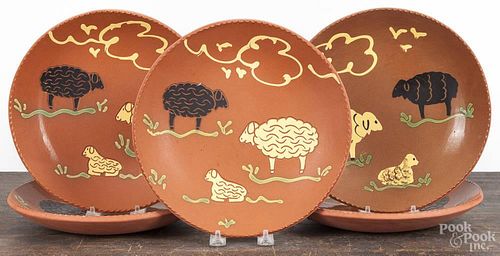 Set of five Lester Breininger redware plates, signed and dated 1997, with sheep decoration, 10 1/4