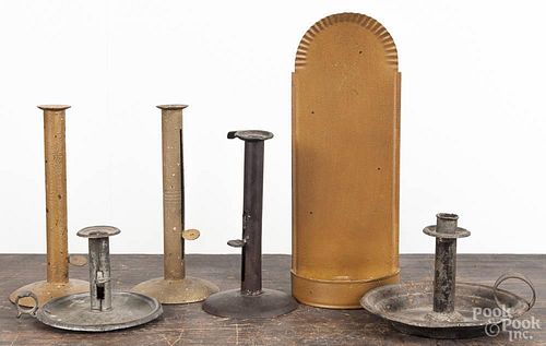Three tin push-up candlesticks, 19th c., together with a pair of contemporary candlesticks and a wal