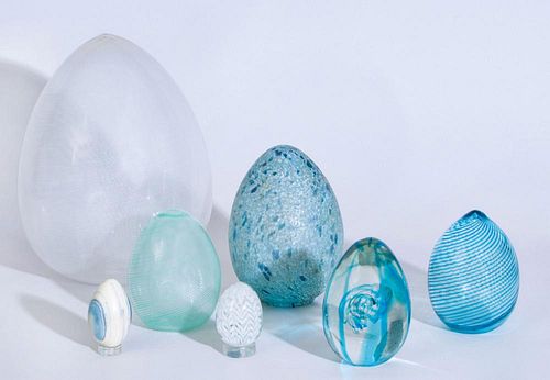 GROUP OF SIX GLASS EGGS AND A PAINTED MARBLE EGG
