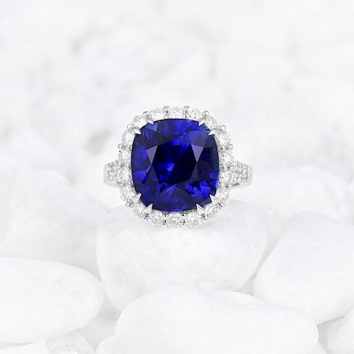 A Vivid Blue 10.02-Carat Sapphire and Diamond Halo Ring