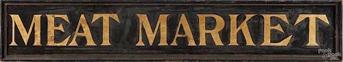 Painted pine Meat Market trade sign, 19th c., with gold gilt letters on a black sand painted backg