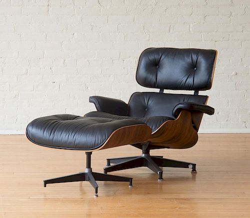 CHARLES AND RAY EAMES / HERMAN MILLER LEATHER UPHOLSTERED ROSEWOOD LOUNGE CHAIR AND OTTOMAN