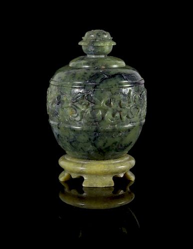 A Carved Spinach Jade Covered Jar