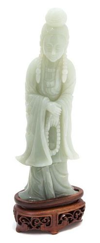 A Carved Celadon Jade Figure of Guanyin