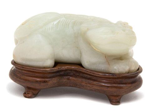 A Carved White Jade Figure of a Mythical Beast
