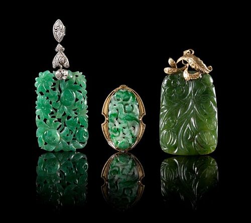 Three Jade and Jadeite Pendants Length of largest 2 1/4 inches.