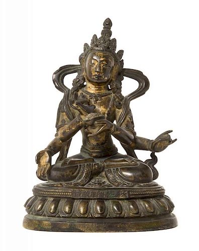 A Sino-Tibetan Parcel-Gilt Bronze Figure of Four-Armed Avalokiteshvara