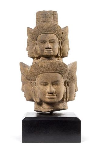 A Khmer Sandstone Head of Brahma 17 inches x 12 1/2 inches.