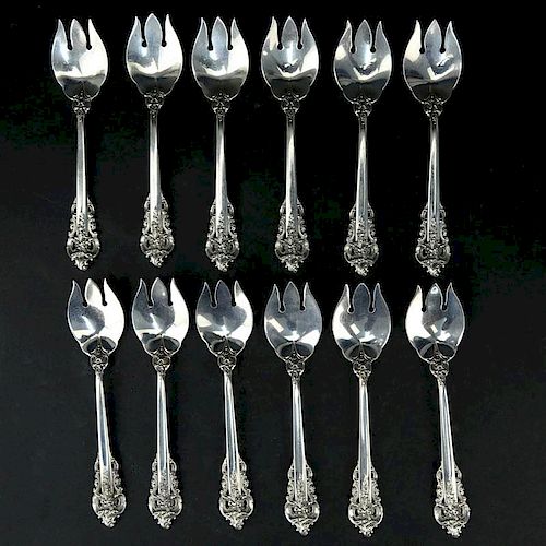 Set of Twelve (12) Wallace "Grand Baroque" Sterling Silver Ice Cream Forks. Circa 1941.