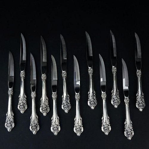 Set of Twelve (12) Wallace "Grand Baroque" Sterling Silver Beveled Steak Knives. Circa 1941.