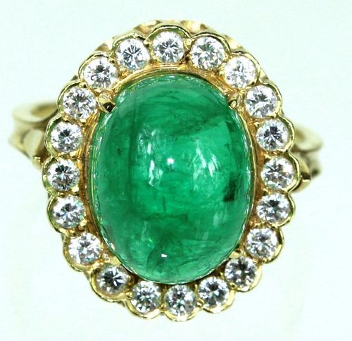 A Lady's 18 Karat Diamond & Cabochon Emerald Ring