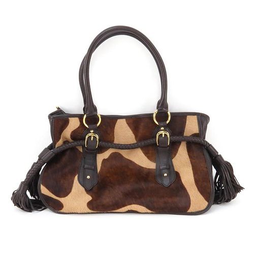 Adrienne Vittadini Cowhide and Leather Bag. Satin interior with zipper and slot pockets, magnetic closure. Marked appropriate