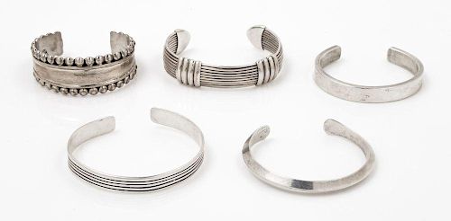 A Collection of Sterling Silver Cuff Bracelets, 102.10 dwts.