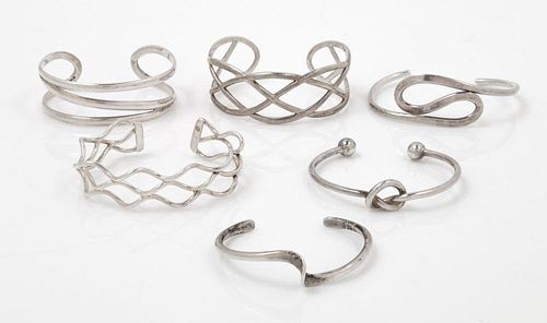 A Collection of Sterling Silver Cuff Bracelets, 77.20 dwts.