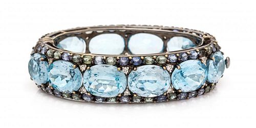 A Black Rhodium 18 Karat Gold, Blue Topaz, Diamond, Blue Sapphire and Green Sapphire Bangle Bracelet, 52.60 dwts.