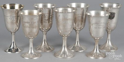 Seven sterling silver horse show goblets