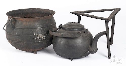 Iron kettle, 19th c., together with a trivet, etc.