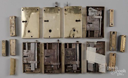 Eight brass box door locks, with associated pieces
