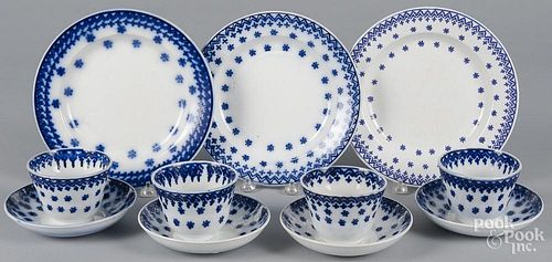 Four flow blue snowflake cups and saucers