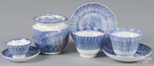 Three blue spatter cups and saucers