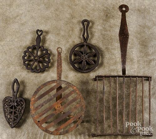 Four wrought iron trivets, 19th c.