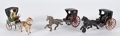 Two cast iron horse drawn carts