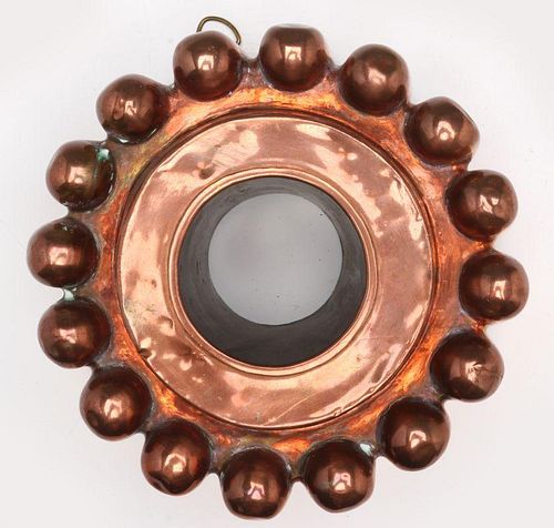 AN ANTIQUE COPPER JELLY MOLD