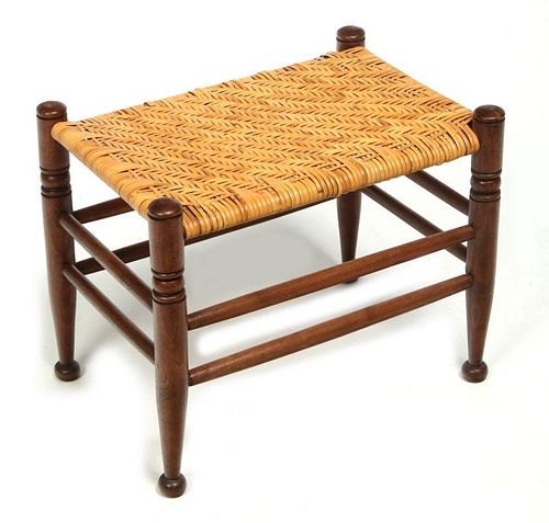 AN EARLY  20TH CENTURY RATTAN TOP FOOT STOOL