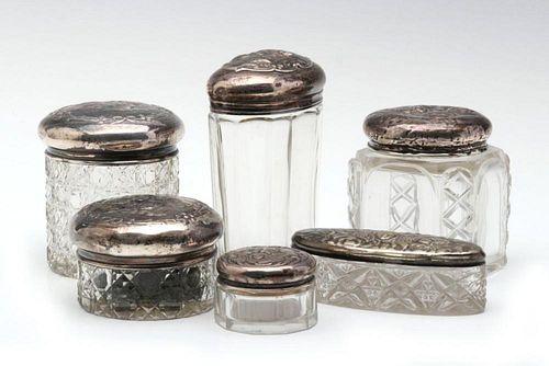 A COLLECTION OF STERLING TOPPED DRESSER JARS