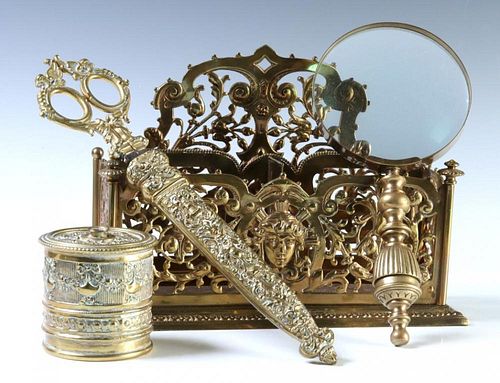 A COLLECTION OF ORNATE BRASS VICTORIAN DESK ITEMS