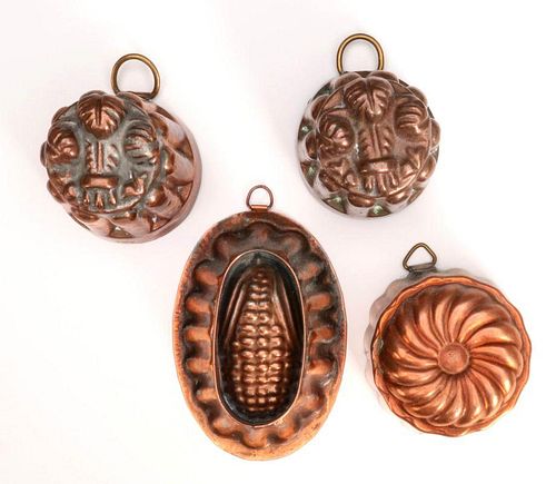 A COLLECTION OF SMALL COPPER FOOD MOLDS