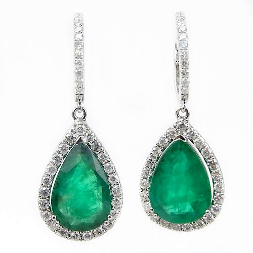 Approx. 6.59 Carat Pear Shape Colombian Emerald, 1.0 Carat Round Brilliant Cut Diamond and 18 Karat White Gold Earrings. .