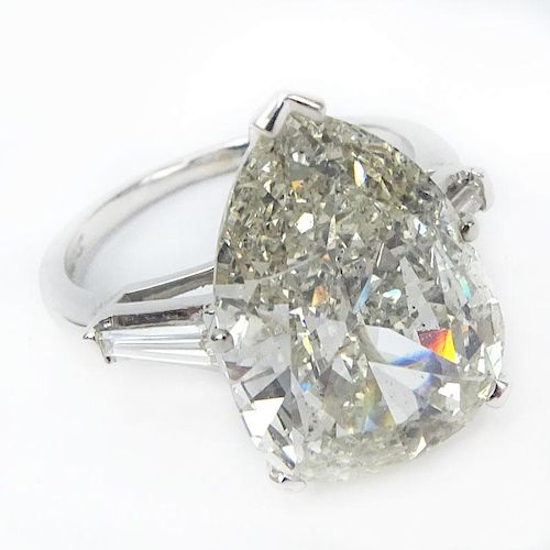 Approx. 6.32 Carat Pear Shape Diamond and Platinum Engagement Ring accented with .50 Carat Tapered Baguette Diamond. .