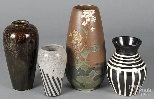 Four art pottery vases,