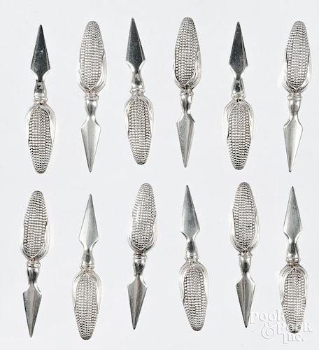 Twelve sterling silver handled corn spears.