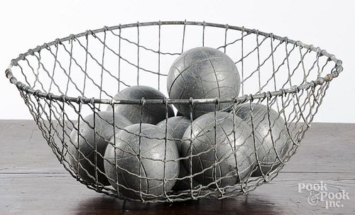 Wire basket with eight stell bocce balls