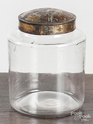 Colorless glass apothecary jar with tin lid