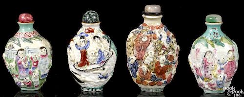 Four Chinese molded porcelain snuff bottles