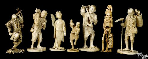 Seven Japanese Meiji period carved ivory figures